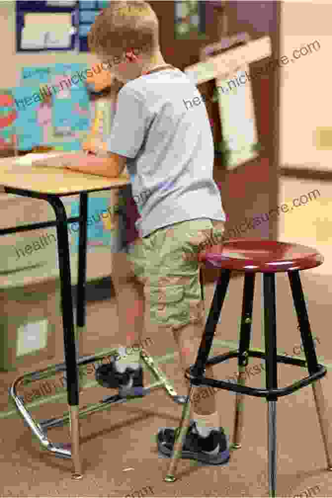 A Child With Autism Sitting At A Desk, Looking Focused And Engaged. Special Needs Kids Eat Right: Strategies To Help Kids On The Autism Spectrum Focus Learn And Thrive