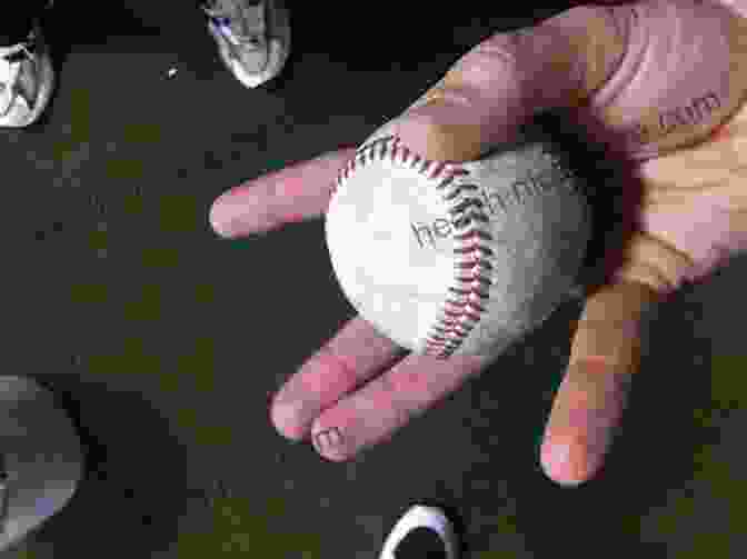 A Pitcher Showcasing The Grip And Release Point Of A Changeup, With Fingers Spread Apart And The Thumb On The Outside Of The Ball 21 Killer Fastpitch Softball Game Winning Strategies