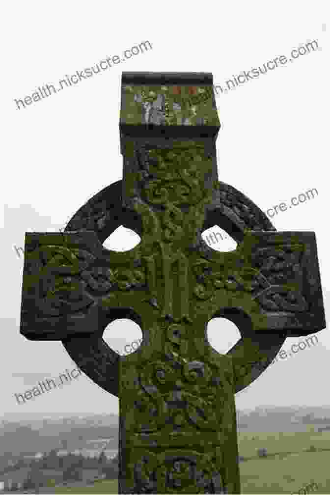 An Ancient Celtic Cross, A Symbol Of Irish Civilization, Stands Tall Against A Backdrop Of Lush Green Hills And Blue Skies. Irish Civilization: An Arthur Aughey