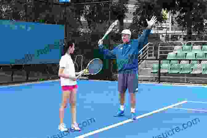 Tennis Coach Working One On One With A Student Tennis Teaching: Art Or Science?: A Modern Guide For Tennis Teachers And Coaches